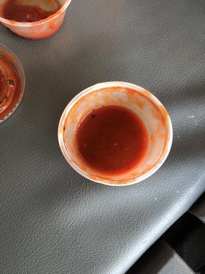 Photo of Roberto's Taco Shop - Las Vegas, NV, US. two empty bowls of sauce on a table