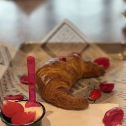 Crème de la Crème - Croissant with butter and edible flowers.