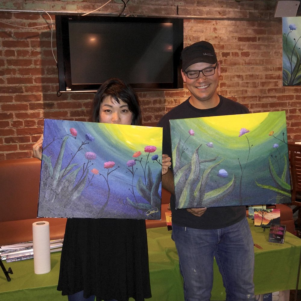 Sushi Hai - a man and a woman holding paintings - Sushi Bars Near Me - Denver, Colorado Sushi Hai - a man and a woman holding paintings - Sushi Bars Near Me - Denver, Colorado