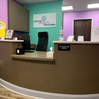 Premier Pediatric Associates - Check-in desk....love the colors! - Pediatricians Near Me - Smyrna, Georgia