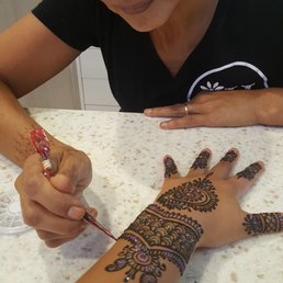 Irene doing her magic. She is so amazing!!! I absolutely love this! This is my first henna and I'm in love! Irene doing her magic. She is so amazing!!! I absolutely love this! This is my first henna and I'm in love!
