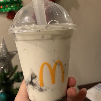 McDonald's - a hand holding a cup of milkshake - Fast Food Near Me - Queen Creek, Arizona