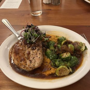 Filibuster Restaurant and Bar - Pork chop on a bed of mashed sweet potatoes with Brussels sprouts. Very good dinner! - Breakfast & Brunch Near Me - Montpelier, Vermont Filibuster Restaurant and Bar - Pork chop on a bed of mashed sweet potatoes with Brussels sprouts. Very good dinner! - Breakfast & Brunch Near Me - Montpelier, Vermont