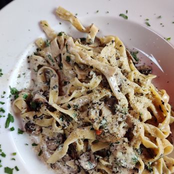The Italians - a plate of pasta with mushrooms and parsley - Italian Near Me - Vancouver, British Columbia The Italians - a plate of pasta with mushrooms and parsley - Italian Near Me - Vancouver, British Columbia