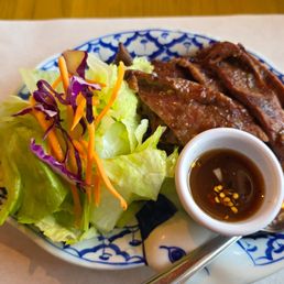 BBQ Steak Thai Style. $16.95 small plate only; comes with steak & small salad. Rice is an extra $3. Steak was a little chewy. Not worth it. BBQ Steak Thai Style. $16.95 small plate only; comes with steak & small salad. Rice is an extra $3. Steak was a little chewy. Not worth it.