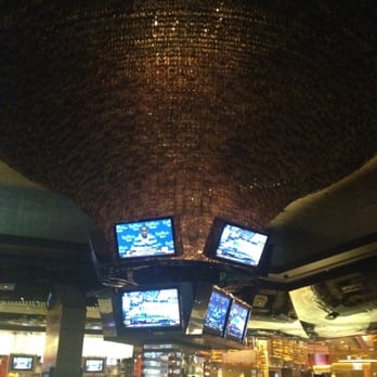 M Bar - Main M bar with tv's around. Kinda cool center of the room with barstools around and some freaky people sitting there. - Lounges Near Me - Henderson, Nevada
