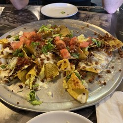 Logan's - This is an amazing place to eat the bartender Mo is great!! She bakes great great drinks!! Make sure you you sure you spot in and see her!!