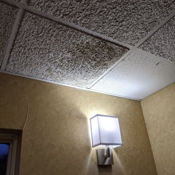 Quality Inn - The water from the ceiling was causing the tile to bubble out. - Hotels Near Me - Greeneville, Tennessee