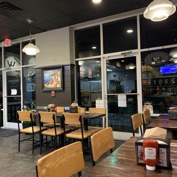 Wayback Burgers - a dining area with tables and chairs - Burgers Near Me - Durham, North Carolina