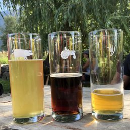 three glasses of beer on a table