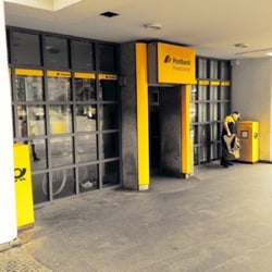 Postamt - Entrance with mailman at work