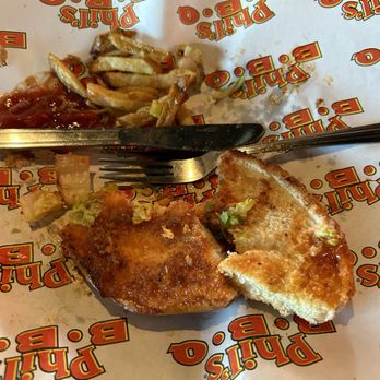 Phil's BBQ - After photo of the chicken sandwich. Alot of bread for a small piece of chicken. - Barbeque Near Me - Temecula, California