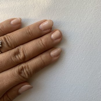 Boutique Nail & Spa - One week and two days out. Broke ANOTHER nail and the tops are peeling off because they were on my cuticle. - Nail Salons Near Me - Northfield, Illinois