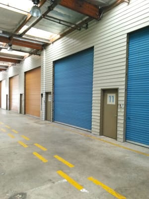 Commercial Garage Doors - Metal frame and complete installation of porbene garage door installation at a storage facility. Commercial Garage Doors - Metal frame and complete installation of porbene garage door installation at a storage facility.