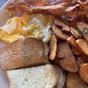 Shelly's Cafe - 2 Egg Combo with Turkey Bacon, Home Fries and Buttered Toast - Breakfast & Brunch Near Me - Tampa, Florida Shelly's Cafe - 2 Egg Combo with Turkey Bacon, Home Fries and Buttered Toast - Breakfast & Brunch Near Me - Tampa, Florida
