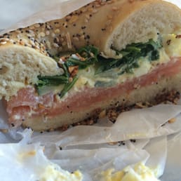 Smoked salmon bagel with egg salad, arugula and cucumbers on an everything bagel. A little salty but good amount of flavor. Smoked salmon bagel with egg salad, arugula and cucumbers on an everything bagel. A little salty but good amount of flavor.