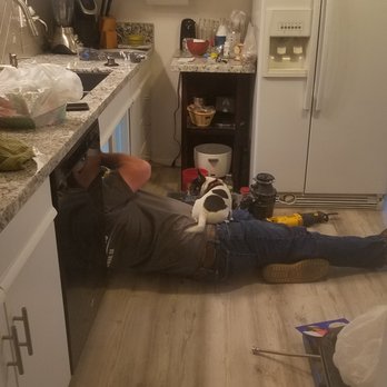 Mikes Plumbing - a man laying on the kitchen floor - Plumbing Near Me - Big Bear City, California Mikes Plumbing - a man laying on the kitchen floor - Plumbing Near Me - Big Bear City, California