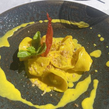 Osteria Quatro Pass - Tortelloni with saffron butter sauce - Italian Near Me - Varenna, SO Osteria Quatro Pass - Tortelloni with saffron butter sauce - Italian Near Me - Varenna, SO