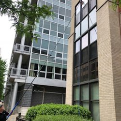 Metro Window Cleaning - Cleaning with deionized water using the water fed pole.