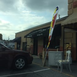 Jimmy's Barbershop - Outside of Jimmy's Barber Shop on a cloudy day