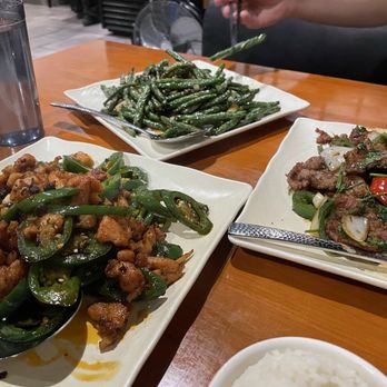 Peppercorns Kitchen - Clockwise from bottom left: Chef Special Stir Fried Chicken (Spicy), Sauted String Beans, Cumin Lamb (Less Spicy) - Chinese Near Me - West Lafayette, Indiana Peppercorns Kitchen - Clockwise from bottom left: Chef Special Stir Fried Chicken (Spicy), Sauted String Beans, Cumin Lamb (Less Spicy) - Chinese Near Me - West Lafayette, Indiana