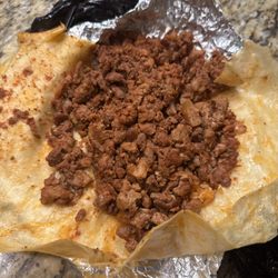 Tacos La Patrona - Oil dripping and sour tasting al pastor burrito.
