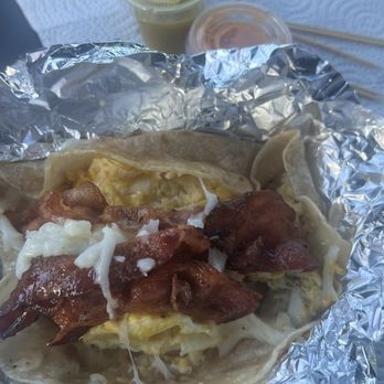 Texas Taco L Express - Egg bacon & cheese taco on a flour tortilla - Breakfast & Brunch Near Me - Houston, Texas Texas Taco L Express - Egg bacon & cheese taco on a flour tortilla - Breakfast & Brunch Near Me - Houston, Texas