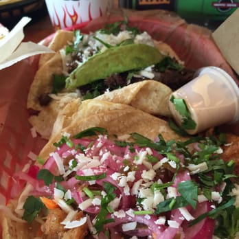 Torchy's Tacos - Baja shrimp(front), trailer park-trashy(back) - Tex-Mex Near Me - Houston, Texas Torchy's Tacos - Baja shrimp(front), trailer park-trashy(back) - Tex-Mex Near Me - Houston, Texas