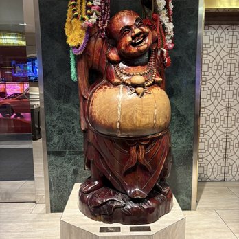 Aloha Specialties - Happy Buddha lounging in the Cal lobby. - Hawaiian Near Me - Las Vegas, Nevada Aloha Specialties - Happy Buddha lounging in the Cal lobby. - Hawaiian Near Me - Las Vegas, Nevada