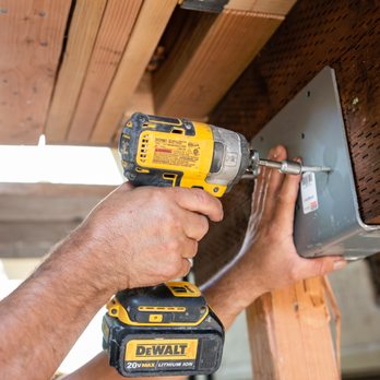 Fixit Construction - a man using a drill to fix a piece of wood - General Contractors Near Me - Oakland, California Fixit Construction - a man using a drill to fix a piece of wood - General Contractors Near Me - Oakland, California
