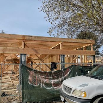 MW Monroy Construction - a truck parked in front of a house under construction - Flooring Near Me - Los Angeles, California