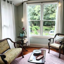 The sitting room in our suite with a gorgeous view of some ancient oak trees