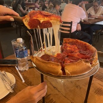 Giordano's - Cheese pull - Pizza Near Me - Chicago, Illinois Giordano's - Cheese pull - Pizza Near Me - Chicago, Illinois