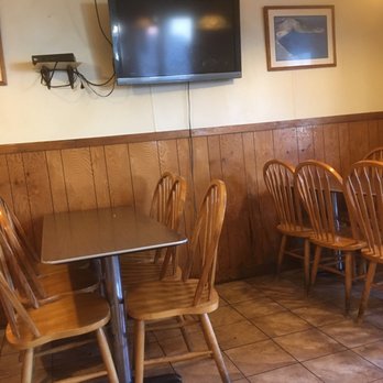 Louis Pizza - a dining area with a flat screen tv - Pizza Near Me - Wolfeboro, New Hampshire Louis Pizza - a dining area with a flat screen tv - Pizza Near Me - Wolfeboro, New Hampshire