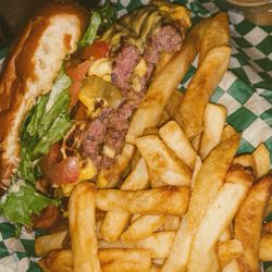 Jupiter Jumbo a double burger with cheese, bacon, lettuce, tomatoes, and grilled onions. This Burger was Huge
