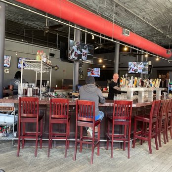 The Bulldog Lowertown - a bar with people sitting at it - Bars Near Me - St Paul, Minnesota