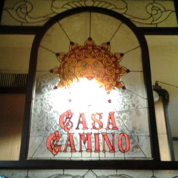 Casa Gamino - Looks like the sun is shining behind the stained glass despite the rain outside - Mexican Near Me - Paramount, California