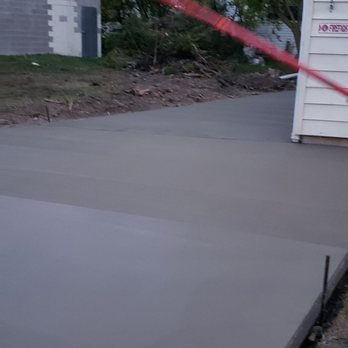 Concept Concrete Construction - a concrete slab being poured - General Contractors Near Me - Clarence Center, New York