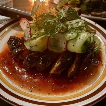 Darling Jack's Tavern - 10 OZ. SMOKED DUROC PORK CHOP smokey morita-apricot glaze, cucumber-melon, mint, blue basil - New American Near Me - Philadelphia, Pennsylvania