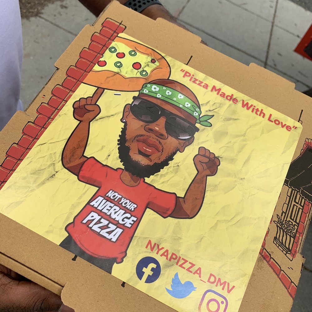 Not Your Average Pizza - a man holding a pizza - Food Trucks Near Me - Washington, DC, District of Columbia Not Your Average Pizza - a man holding a pizza - Food Trucks Near Me - Washington, DC, District of Columbia