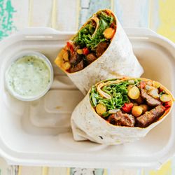 Sumac - Butcher's Kofte (Meatball) Wrap. Comes with fresh herbs yogurt sauce and hot sauce.