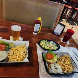 Kiwi's Pub & Grill - Swiss burger and fries $11