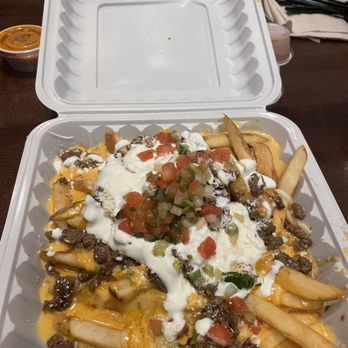 El Comal - a container of fries with cheese and toppings - Mexican Near Me - San Jacinto, California El Comal - a container of fries with cheese and toppings - Mexican Near Me - San Jacinto, California