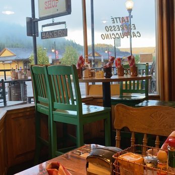 Wagon Train Coffee Shop - Table area towards the front with view of train station and mountains. - Coffee & Tea Near Me - Truckee, California Wagon Train Coffee Shop - Table area towards the front with view of train station and mountains. - Coffee & Tea Near Me - Truckee, California