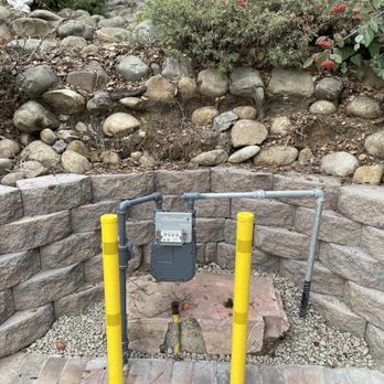 GCG Landscaping & Masonry - Rounded block wall near meter with dirt behind removed. - Masonry/Concrete Near Me GCG Landscaping & Masonry - Rounded block wall near meter with dirt behind removed. - Masonry/Concrete Near Me