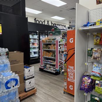 CVS Pharmacy - Inside a grocery store, shelves stocked with snacks, bottled water, and refrigerated beverages are visible. - Drugstores Near Me - Arlington, Virginia