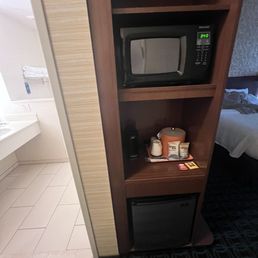 Microwave and mini refrigerator with a coffee maker and a ice bucket