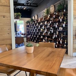 Dos Olivos Market - Dining nook & wall of wine