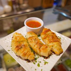 Master Pizza - Garlic Cheese rolls with a side of sauce