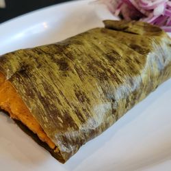 Kausa Peruvian Restaurant - The tamales are steamed in banana leaves, leaving them so moist and delectable.